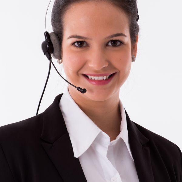 Friendly eTicket Trips travel specialist wearing a headset, ready to help